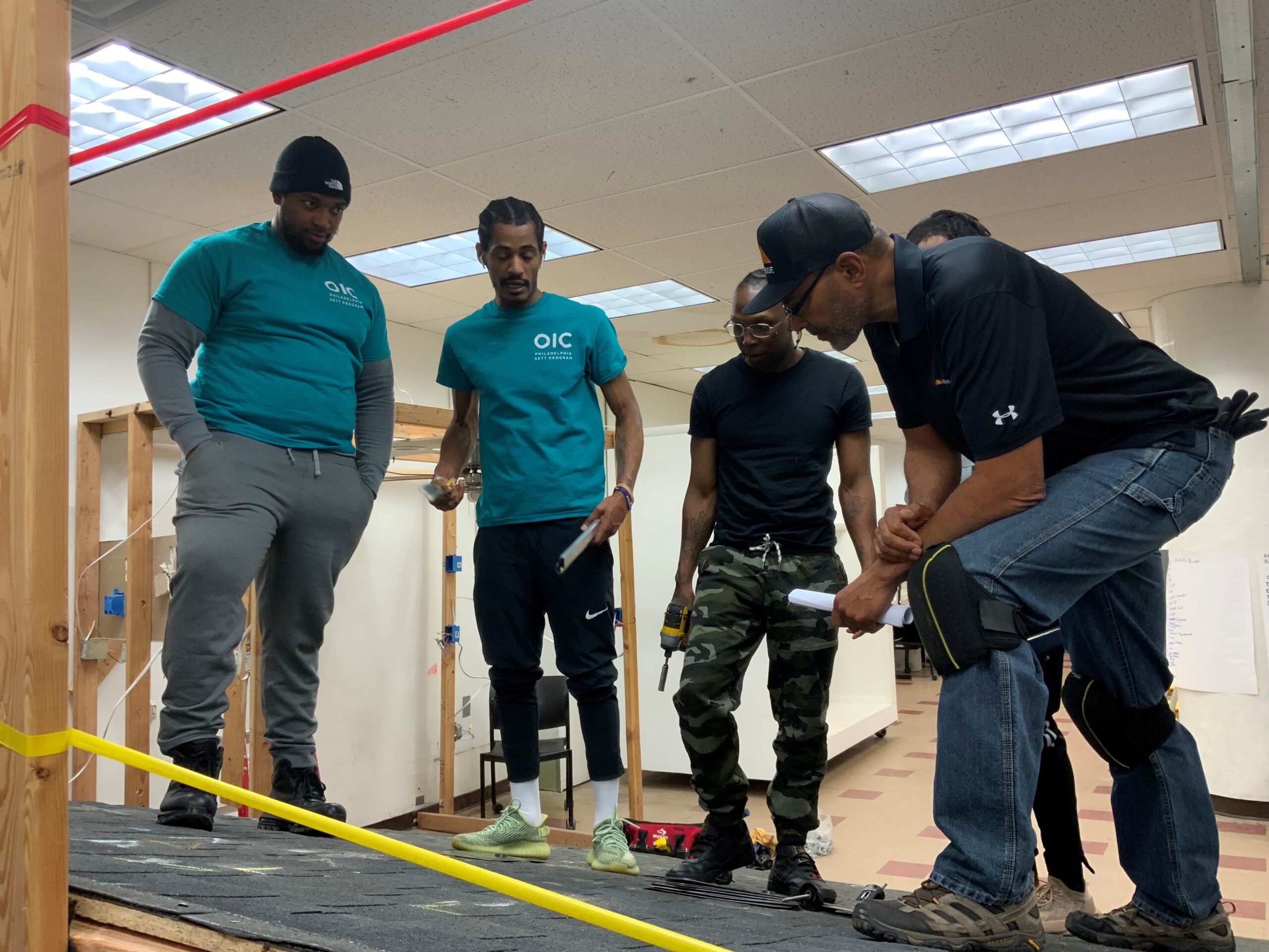 SETT skilled trades students learning solar on mock roof at OIC Philadelphia